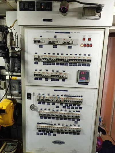  Yacht Photos Pics Electrical control panel on a 2005 Pershing 76 yacht, featuring switches and meters.