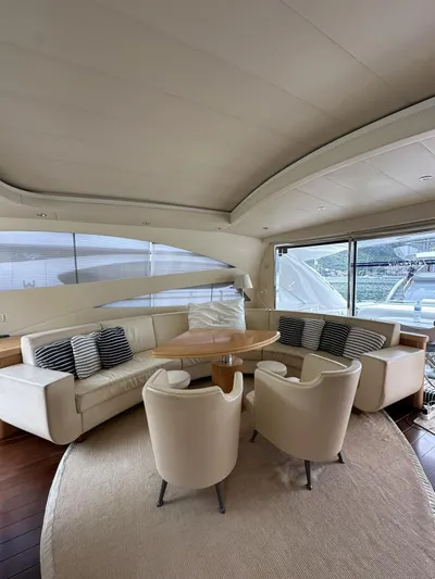  Yacht Photos Pics Luxurious interior of a 2005 Pershing 76 yacht with elegant seating and modern design.