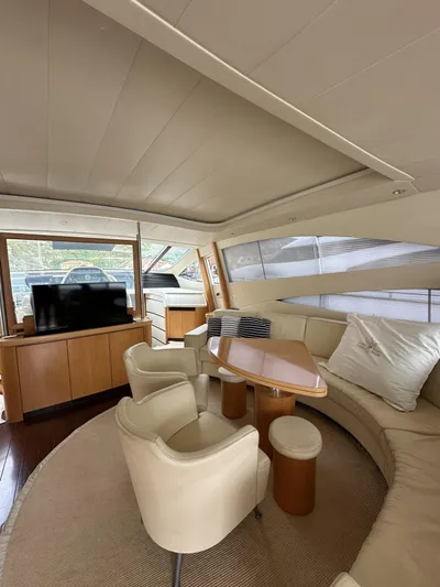 Yacht Photos Pics Luxurious interior of a 2005 Pershing 76 yacht with elegant seating and modern decor.