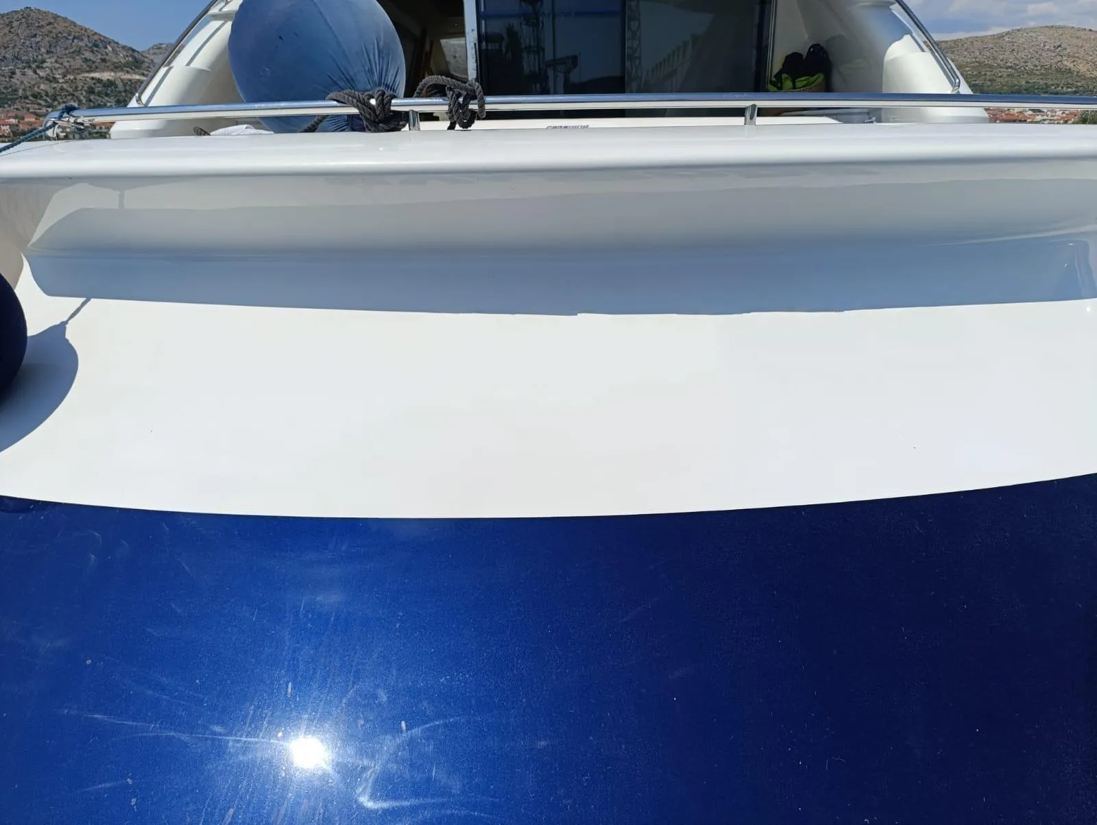 2005 Pershing 76 yacht deck with sleek blue and white design.