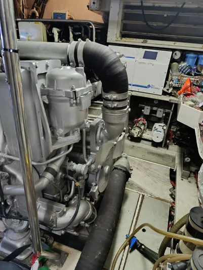  Yacht Photos Pics Engine room of a 2005 Pershing 76 yacht, showcasing mechanical components and equipment.