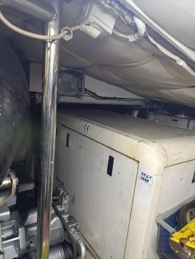  Yacht Photos Pics Engine room of a 2005 Pershing 76 yacht, showcasing machinery and equipment.