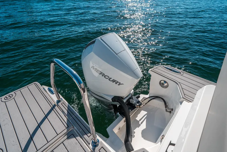 Era Ora Yacht Photos Pics Aquila 32 Sport 2022 boat with Mercury outboard engine on sparkling water.