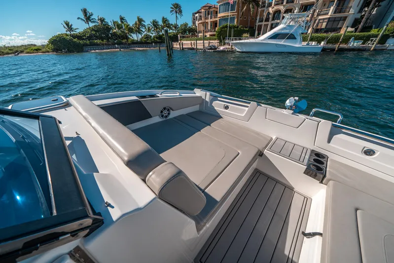 Era Ora Yacht Photos Pics Aquila 32 Sport 2022 boat interior with luxurious seating and scenic waterfront view.