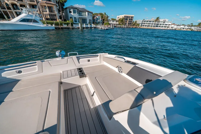 Era Ora Yacht Photos Pics Aquila 32 Sport 2022 boat interior with waterfront view, luxurious seating, and modern design.