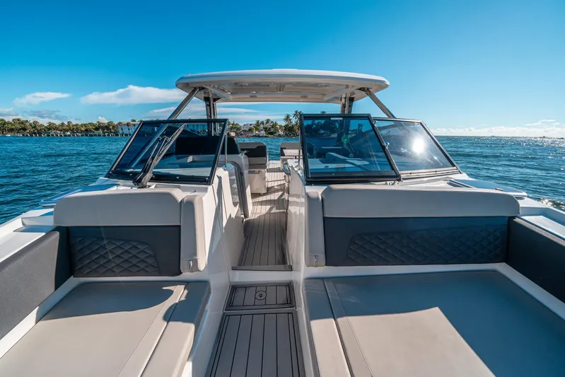 Era Ora Yacht Photos Pics Aquila 32 Sport 2022 boat interior with seating, on a sunny day at sea.