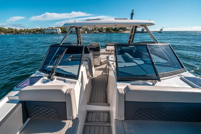 Era Ora Yacht Photos Pics Aquila 32 Sport 2022 boat on water, featuring sleek design and spacious seating.