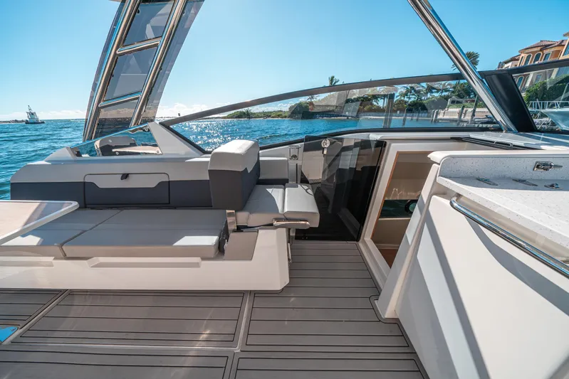 Era Ora Yacht Photos Pics Aquila 32 Sport 2022 yacht interior with sleek seating and ocean view.