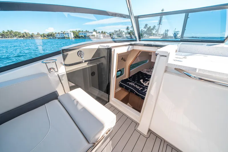 Era Ora Yacht Photos Pics 2022 Aquila 32 Sport boat interior with open cabin and waterfront view.