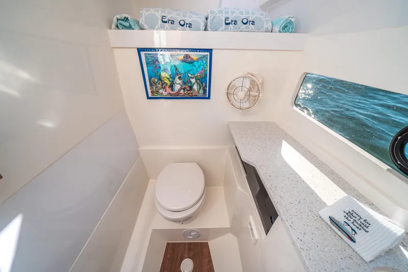 Era Ora Yacht Photos Pics Luxurious bathroom in 2022 Aquila 32 Sport yacht with modern amenities and ocean view.