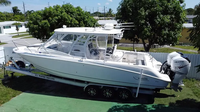  Yacht Photos Pics 2007 Boston Whaler 320 Outrage Cuddy Cabin on trailer, parked outdoors.