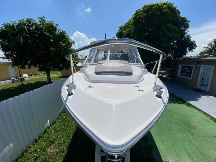  Yacht Photos Pics 2007 Boston Whaler 320 Outrage Cuddy Cabin, docked outdoors, sunny day.