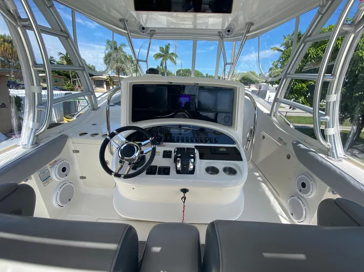  Yacht Photos Pics 2007 Boston Whaler 320 Outrage Cuddy Cabin helm with modern controls and navigation systems.