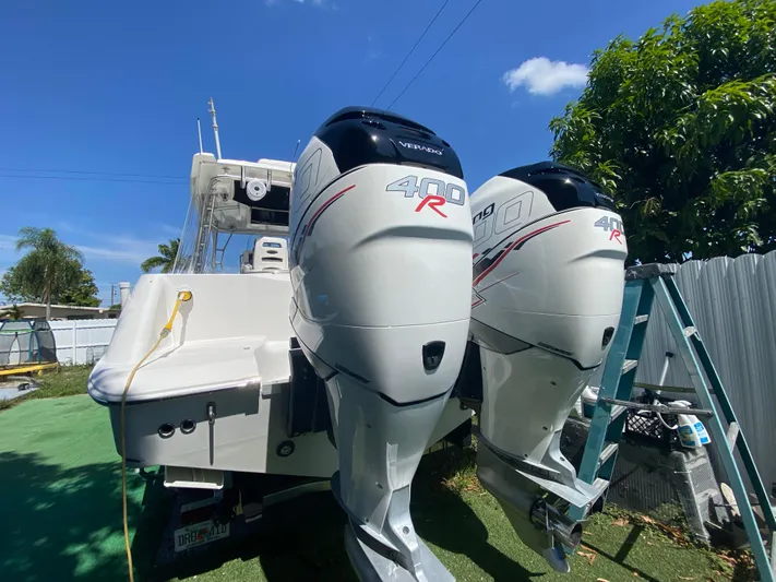  Yacht Photos Pics 2007 Boston Whaler 320 Outrage Cuddy Cabin with twin 400R engines, parked outdoors.