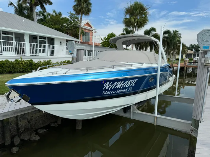 Namaste Yacht Photos Pics 2019 Formula 310 Bowrider OB boat docked, blue hull, "NAMASTE" text, Marco Island, FL.