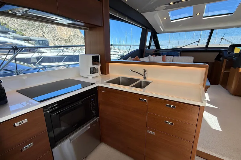 Stra Dodo Yacht Photos Pics Luxurious 2019 Princess S65 yacht interior with modern kitchen and scenic marina view.