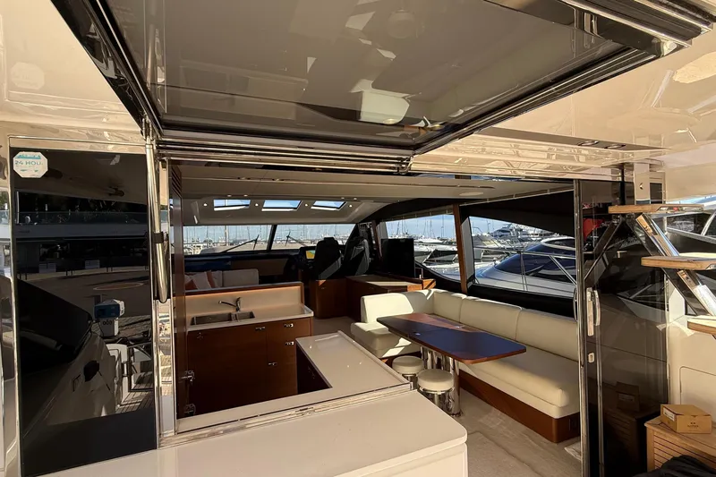 Stra Dodo Yacht Photos Pics Luxurious interior of 2019 Princess S65 yacht with modern seating and kitchen area.