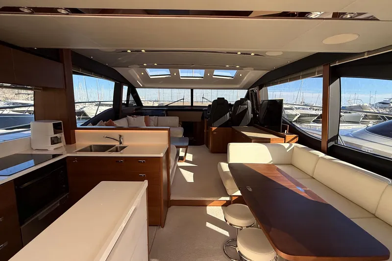 Stra Dodo Yacht Photos Pics Luxurious interior of 2019 Princess S65 yacht with modern kitchen and seating area.