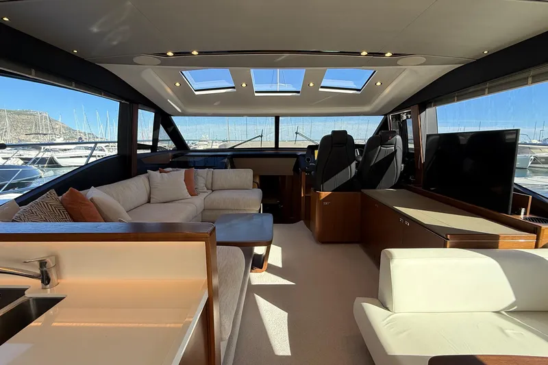 Stra Dodo Yacht Photos Pics Luxurious interior of 2019 Princess S65 yacht with plush seating and panoramic windows.
