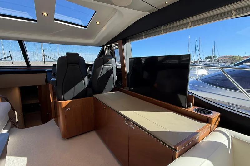 Stra Dodo Yacht Photos Pics Luxurious interior of 2019 Princess S65 yacht with modern seating and large windows.