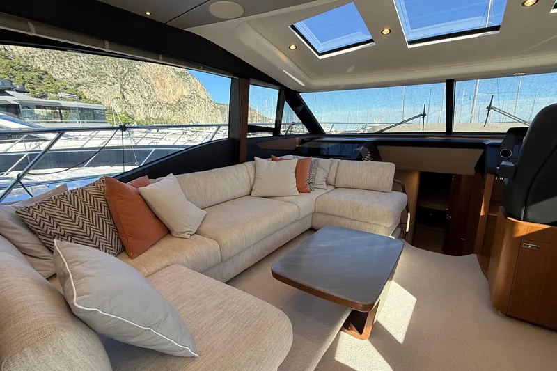 Stra Dodo Yacht Photos Pics Luxurious interior of 2019 Princess S65 yacht with plush seating and panoramic windows.