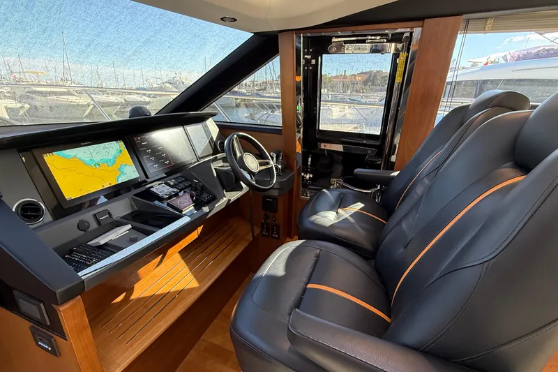 Stra Dodo Yacht Photos Pics Luxurious 2019 Princess S65 yacht cockpit with leather seats and advanced navigation displays.