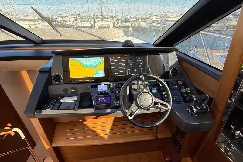 Stra Dodo Yacht Photos Pics 2019 Princess S65 yacht helm with navigation screens and steering wheel.