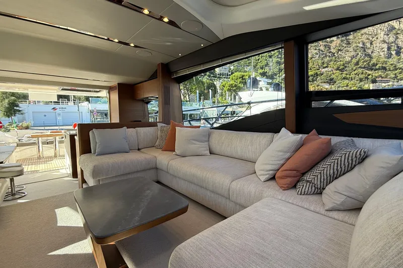 Stra Dodo Yacht Photos Pics Luxurious interior of 2019 Princess S65 yacht with plush seating and scenic views.