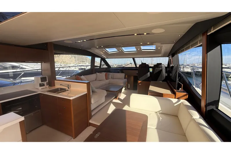 Stra Dodo Yacht Photos Pics Luxurious interior of 2019 Princess S65 yacht with modern furnishings and panoramic windows.