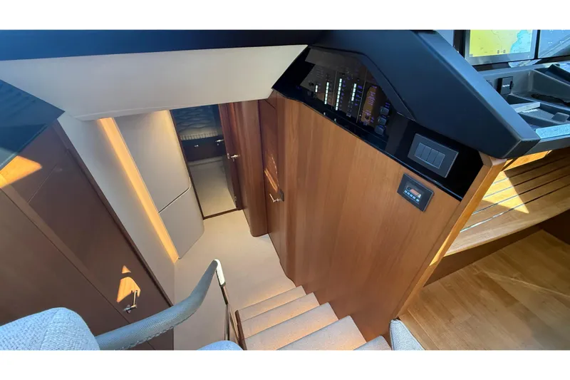 Stra Dodo Yacht Photos Pics Interior of 2019 Princess S65 yacht, featuring wooden stairs and modern design elements.