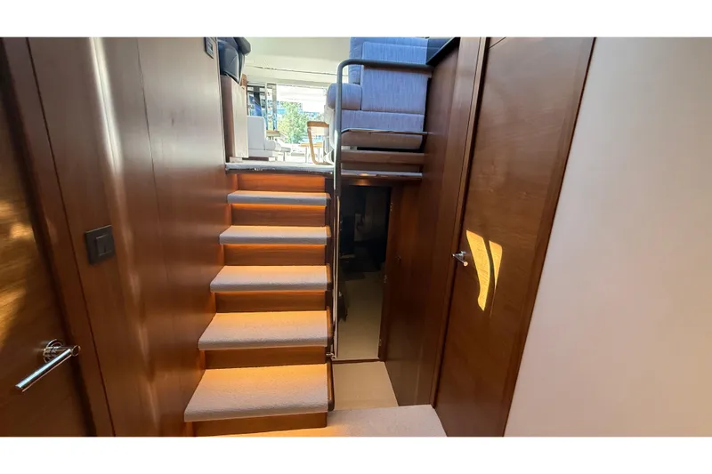 Stra Dodo Yacht Photos Pics Interior of 2019 Princess S65 yacht with wooden stairs and modern design.