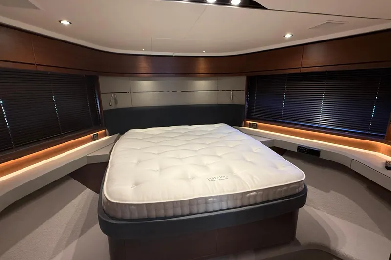 Stra Dodo Yacht Photos Pics Luxurious bedroom interior of 2019 Princess S65 yacht with elegant wood accents.