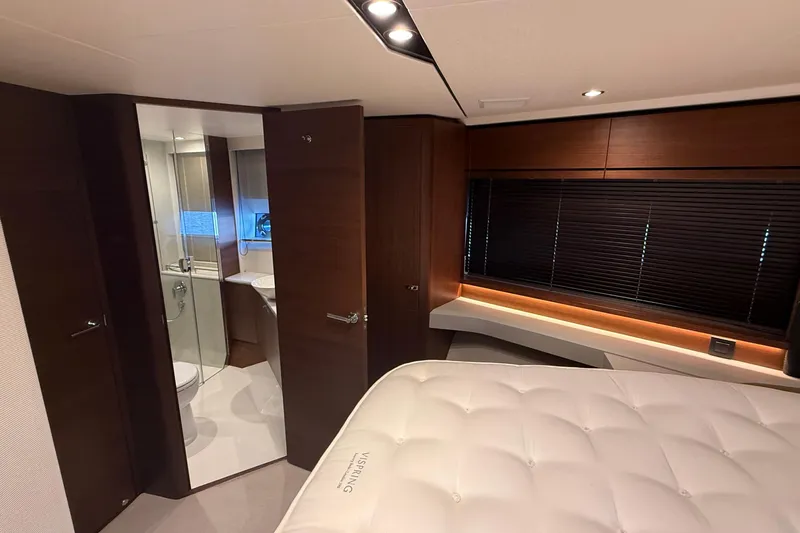Stra Dodo Yacht Photos Pics Luxurious interior of 2019 Princess S65 yacht with modern bedroom and ensuite bathroom.