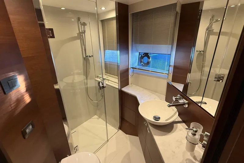 Stra Dodo Yacht Photos Pics Luxurious bathroom in a 2019 Princess S65 yacht with modern fixtures and elegant design.