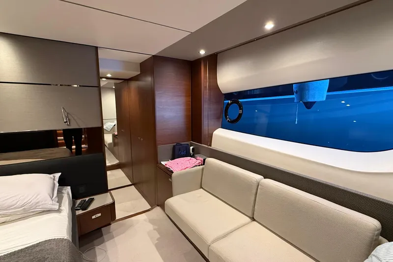 Stra Dodo Yacht Photos Pics Luxurious interior of 2019 Princess S65 yacht with modern furnishings and large window view.