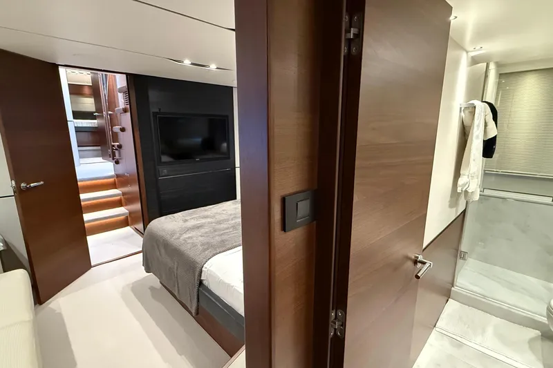 Stra Dodo Yacht Photos Pics Luxurious interior of 2019 Princess S65 yacht featuring bedroom and bathroom.