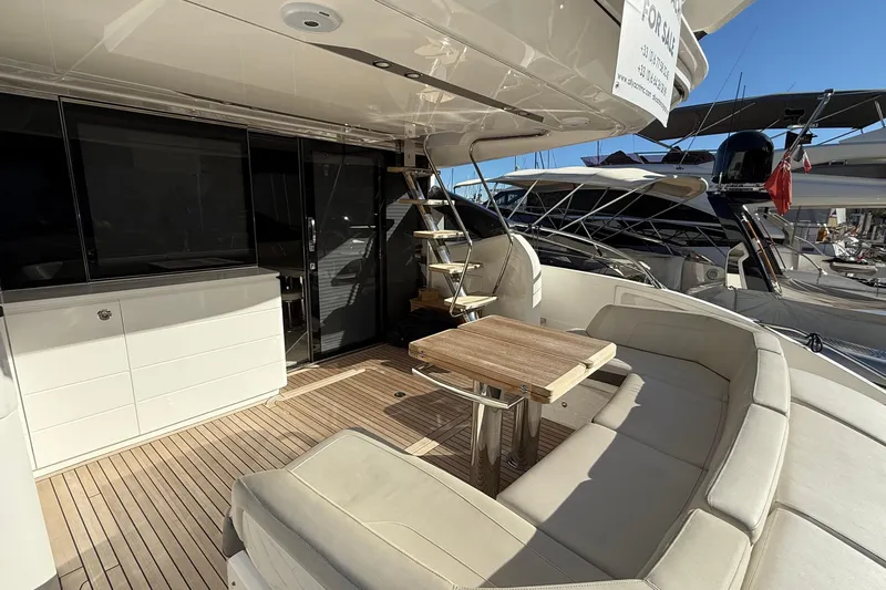 Stra Dodo Yacht Photos Pics Luxurious 2019 Princess S65 yacht deck with seating and table, showcasing elegant design.