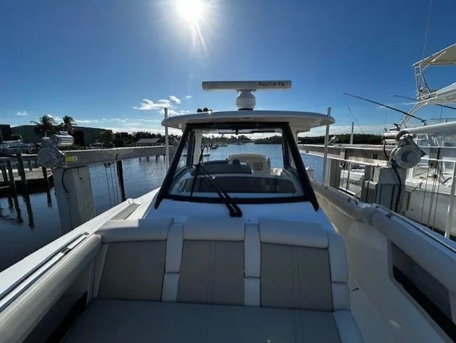  Yacht Photos Pics Boston Whaler 350 EX 2021 at dock under sunny sky.