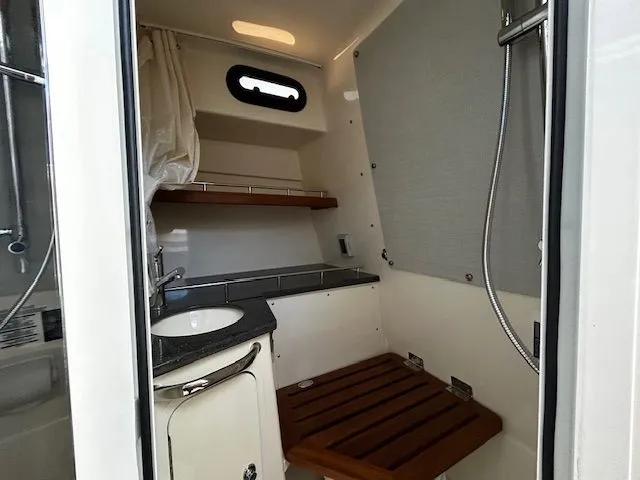  Yacht Photos Pics Interior of 2021 Boston Whaler 350 EX with bathroom and shower.