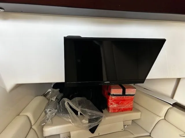  Yacht Photos Pics Interior of 2021 Boston Whaler 350 EX with TV and seating area.