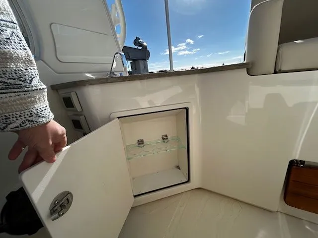  Yacht Photos Pics Interior of 2021 Boston Whaler 350 EX with open cabinet door.