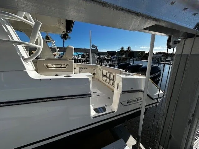  Yacht Photos Pics Boston Whaler 350 EX 2021 at dock with blue sky.
