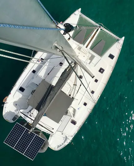Katarina Yacht Photos Pics Overhead view of 2010 Lagoon 440 catamaran on turquoise water.