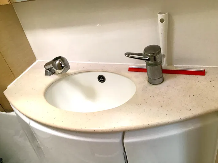 Katarina Yacht Photos Pics Bathroom sink in a 2010 Lagoon 440 yacht with modern fixtures.