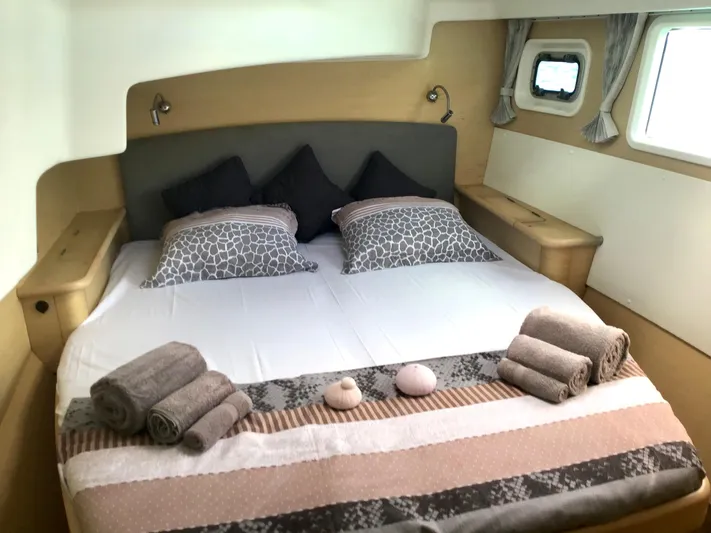 Katarina Yacht Photos Pics Luxurious cabin interior of 2010 Lagoon 440 yacht with neatly arranged bed and towels.