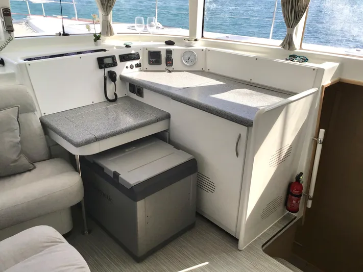 Katarina Yacht Photos Pics Interior of 2010 Lagoon 440 yacht with navigation equipment and seating area.