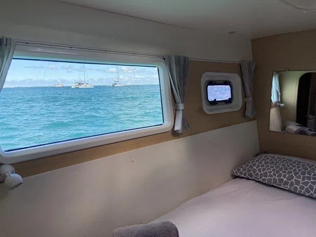 Katarina Yacht Photos Pics Interior cabin view of 2010 Lagoon 440 catamaran with ocean view through windows.