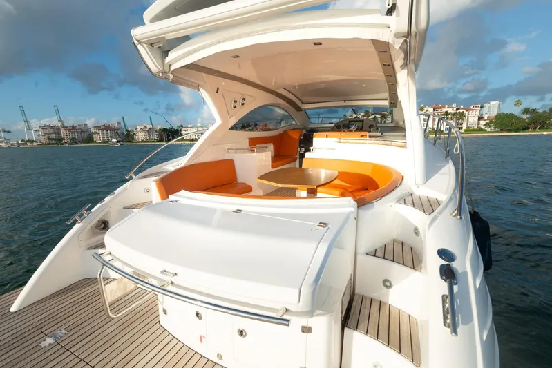  Yacht Photos Pics 2018 Schaefer 400 Sport yacht with orange seating and wooden deck.