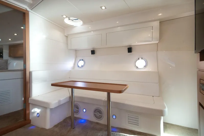  Yacht Photos Pics Interior of 2018 Schaefer 400 Sport yacht with white seating and wooden table.