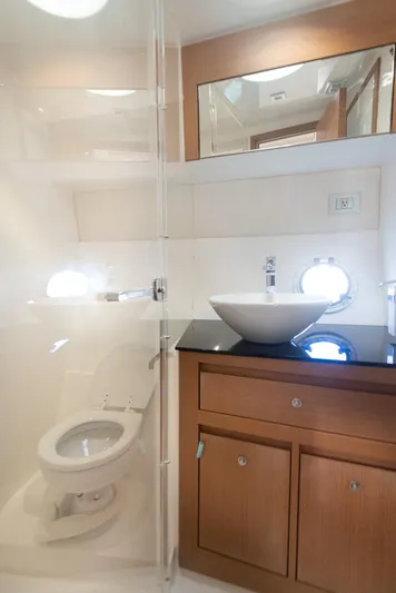  Yacht Photos Pics 2018 Schaefer 400 Sport yacht bathroom with modern fixtures and wooden cabinetry.